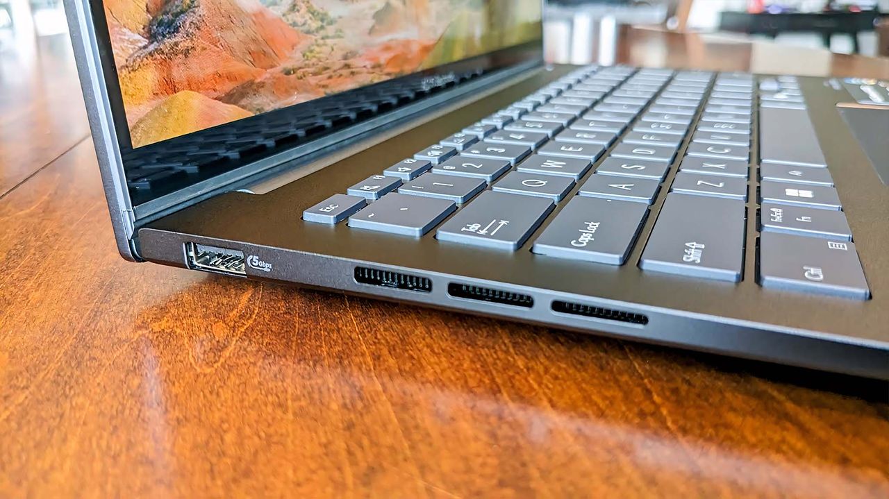 ASUS Zenbook 14 UM3406HA) left port.