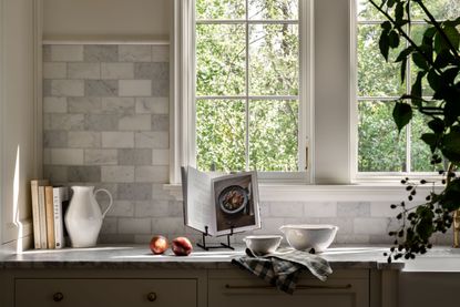 a countertop with books and bowls on