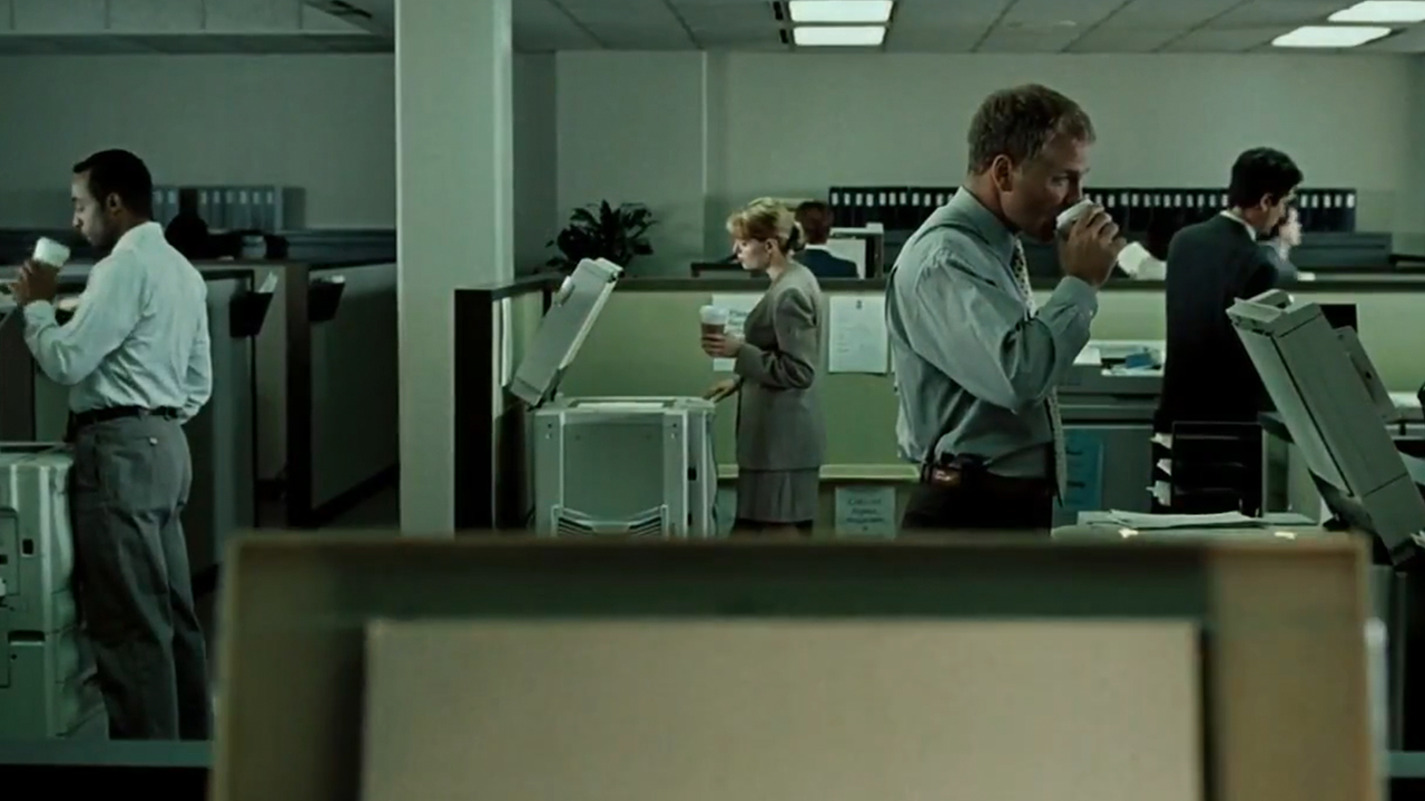 Different people in an office all drinking from Starbucks Cups In Fight Club