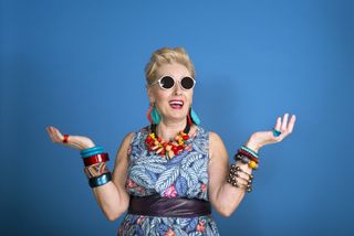 A woman in funky bright clothes