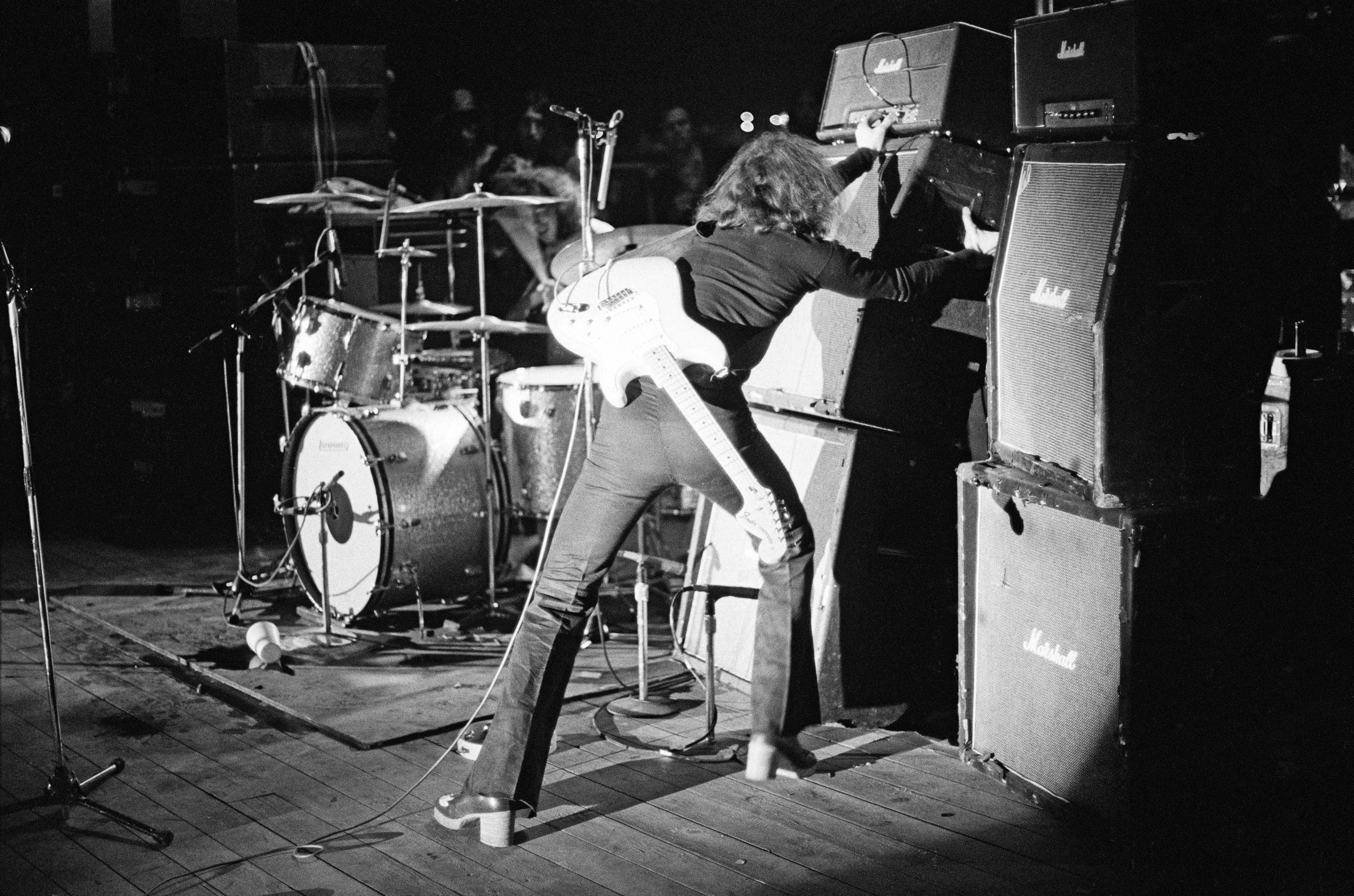 Ritchie Blackmore from Deep Purple adjusts his guitar amplifiers live on stage during the group's North American tour in December 1974