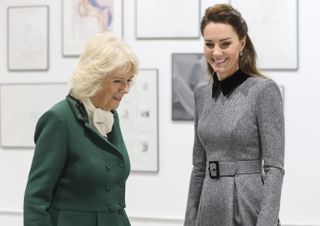 Future Queens Camilla, Duchess of Cornwall and Kate, Duchess of Cambridge laugh as a duo during their visit to The Prince's Foundation training site