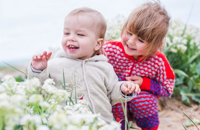 siblings playing outside