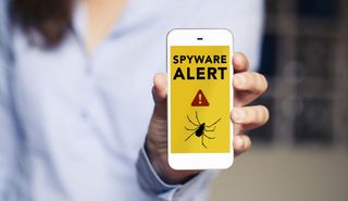 A spyware alert displaying on a smartphone.