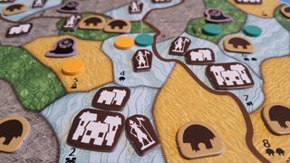 City, town, and colonist tokens strewn across the Horizons of Spirit Island board