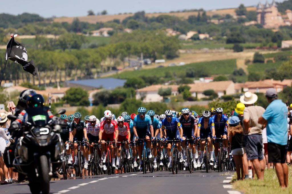 The pack rides during the 13th stage of the 108th edition of the Tour de France cycling race 219 km between Nimes and Carcassonne on July 09 2021 Photo by Thomas SAMSON AFP Photo by THOMAS SAMSONAFP via Getty Images