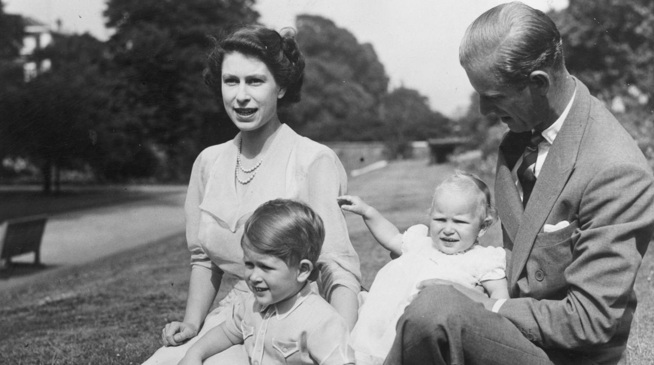 Princess Elizabeth and Prince Philip, Duke of Edinburgh with their two children, Prince Charles and Princess Anne in the grounds of Clarence House, London.