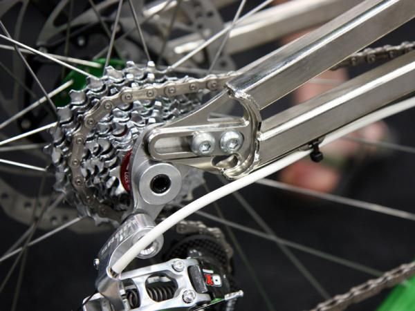 Sliding dropouts on Bicycle Innovations' striking downhill bike allow for tunable handling.