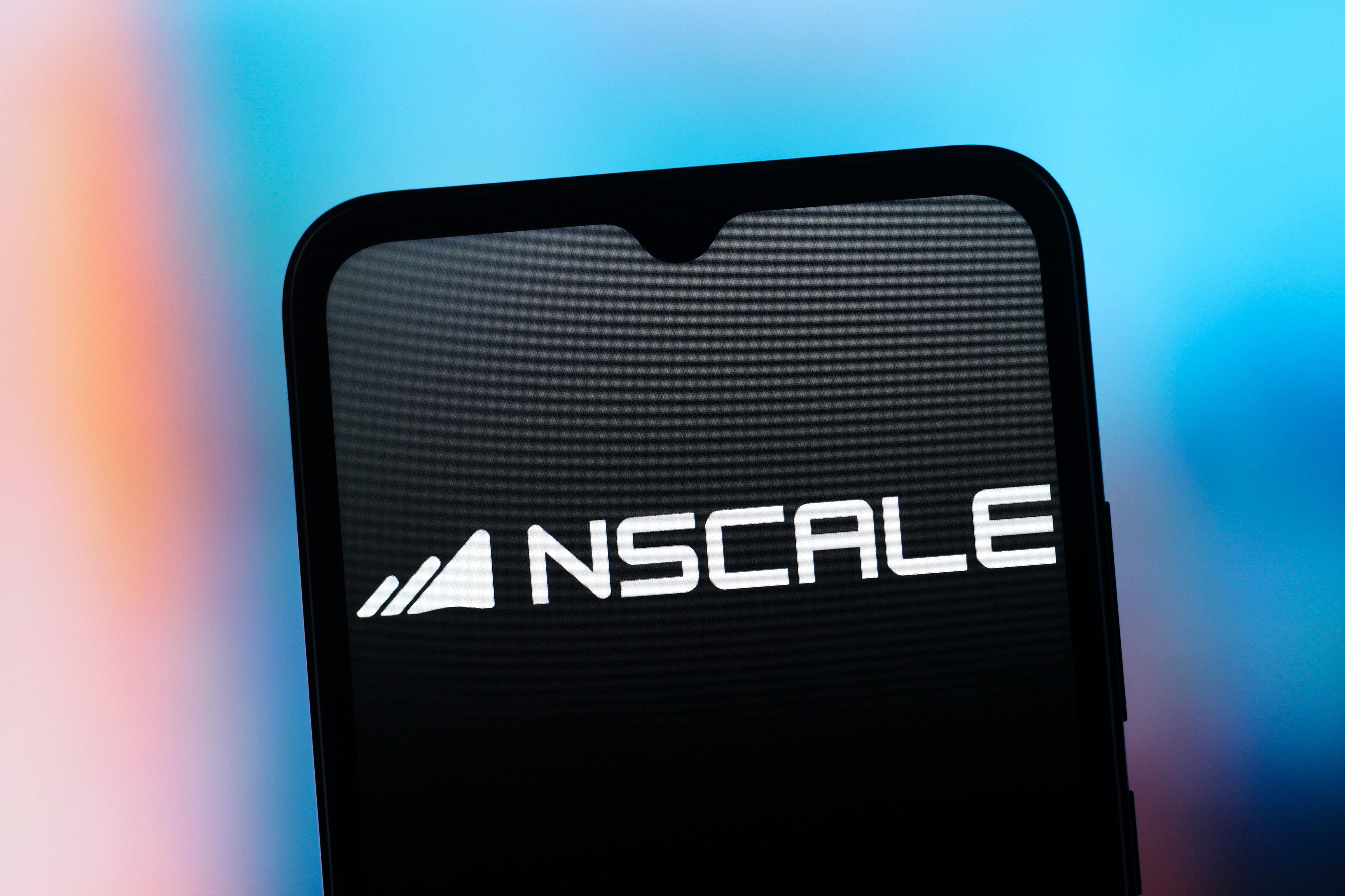 Logo and branding of UK AI infrastructure provider Nscale pictured on a smartphone screen.