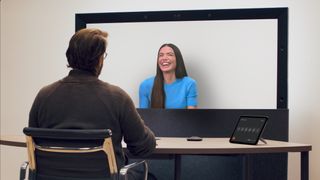 Two people having a 3D video chat with Google Beam