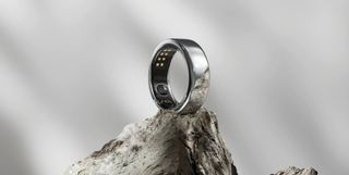 Oura Smart Ring promotional shot ontop of rock with grey background