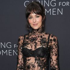 Dakota Johnson attended the Kering Caring For Women NYFW event in a naked lace Gucci dress