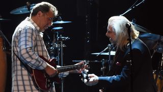 Vince Gill (left) and Joe Walsh perform onstage with the Eagles at The Grand Ole Opry in Nashville, Tennessee on October 29, 2017