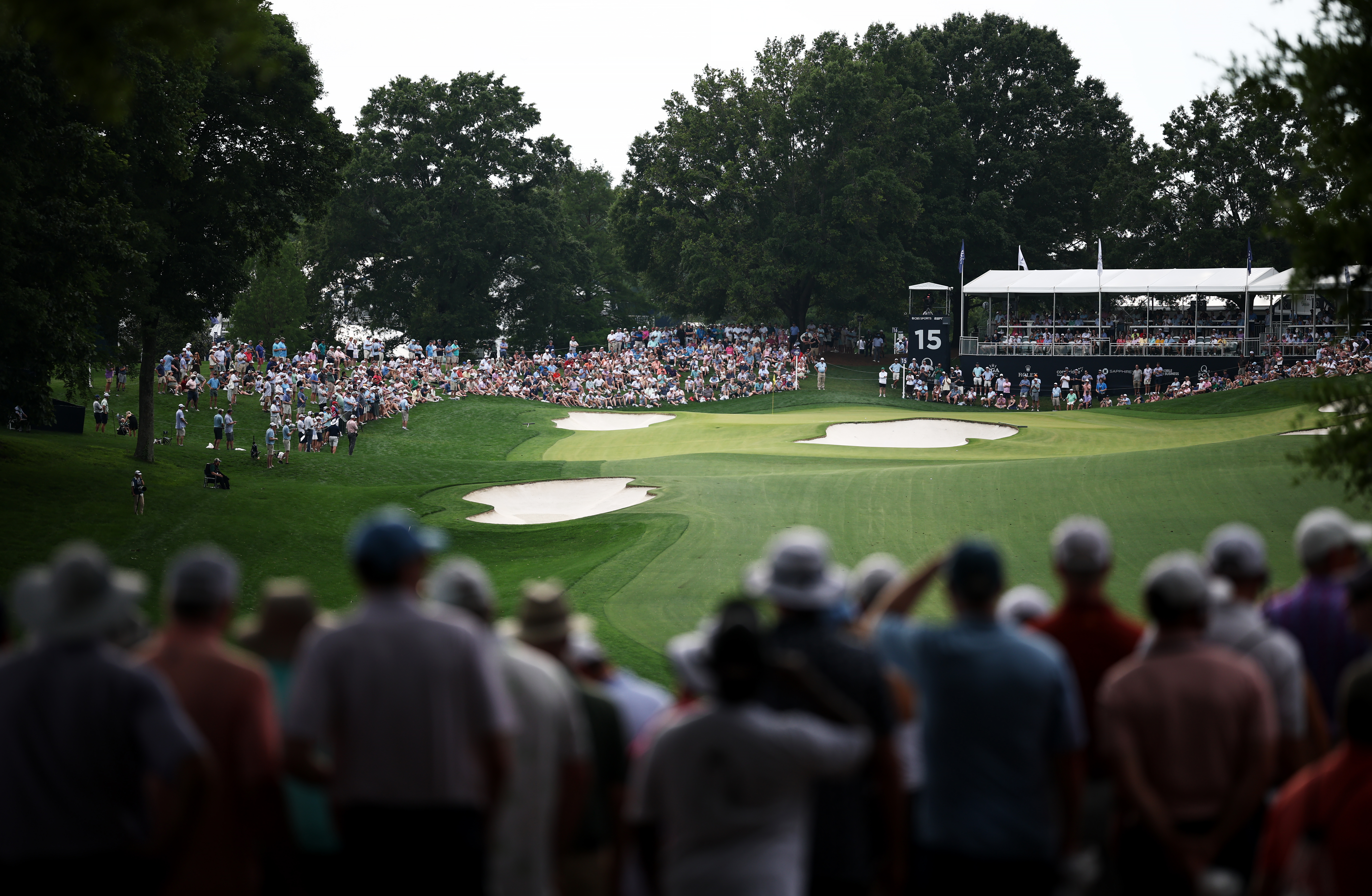 Quail Hollow Club's 15th hole surrounded by fans