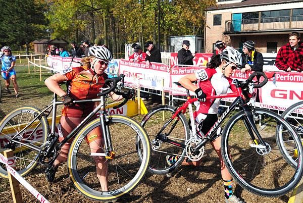 The elite women run the barriers in front of the beer garden.