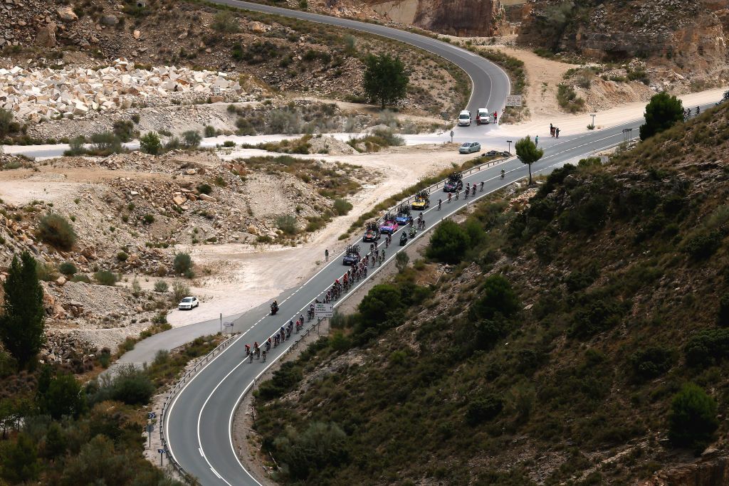 VELEFIQUE SPAIN AUGUST 22 The peloton competes through a landscape during the 76th Tour of Spain 2021 Stage 9 a 188 km stage from Puerto Lumbreras to Alto de Velefique 1800m lavuelta LaVuelta21 on August 22 2021 in Velefique Spain Photo by Gonzalo Arroyo MorenoGetty Images