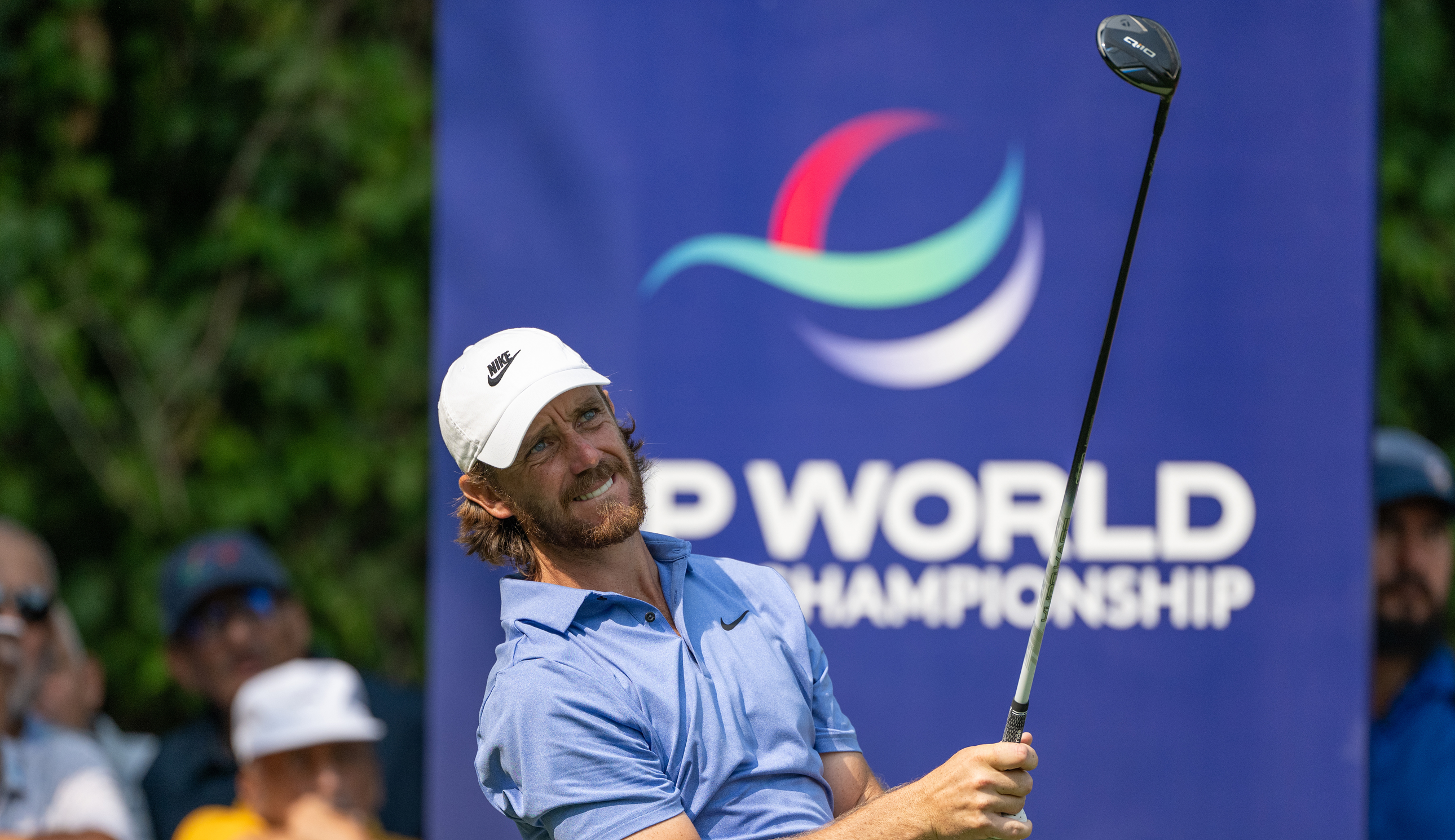 Tommy Fleetwood hits a fairway wood