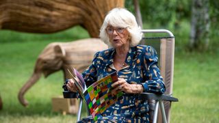 Queen Camilla reading a book