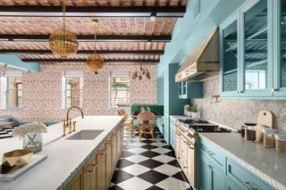 Ken Fulk designed blue kitchen with floral wallpaper