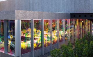 View of the stained glass style windows from the outside of the building