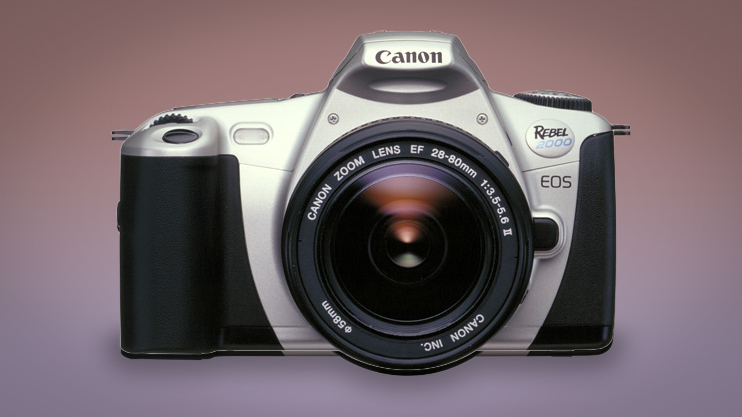 A Canon EOS Rebel 2000 – known as the Canon EOS 300 in Europe and the EOS Kiss III in Japan – against a purple background 
