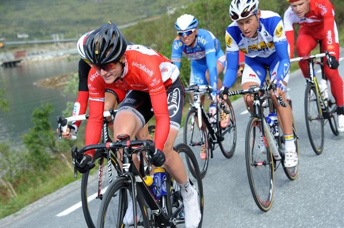 August Jensen in the red jersey at Arctic Race of Norway