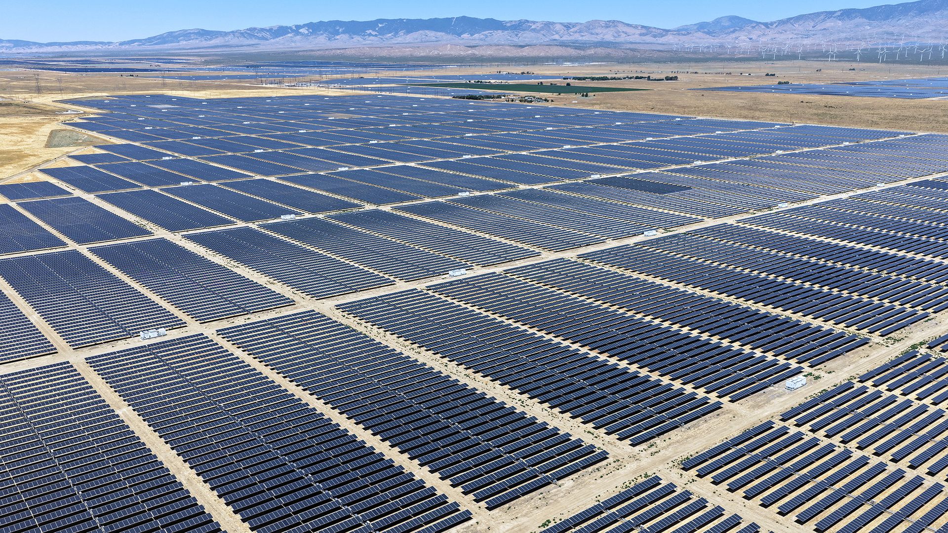An aerial view of rows of solar panels