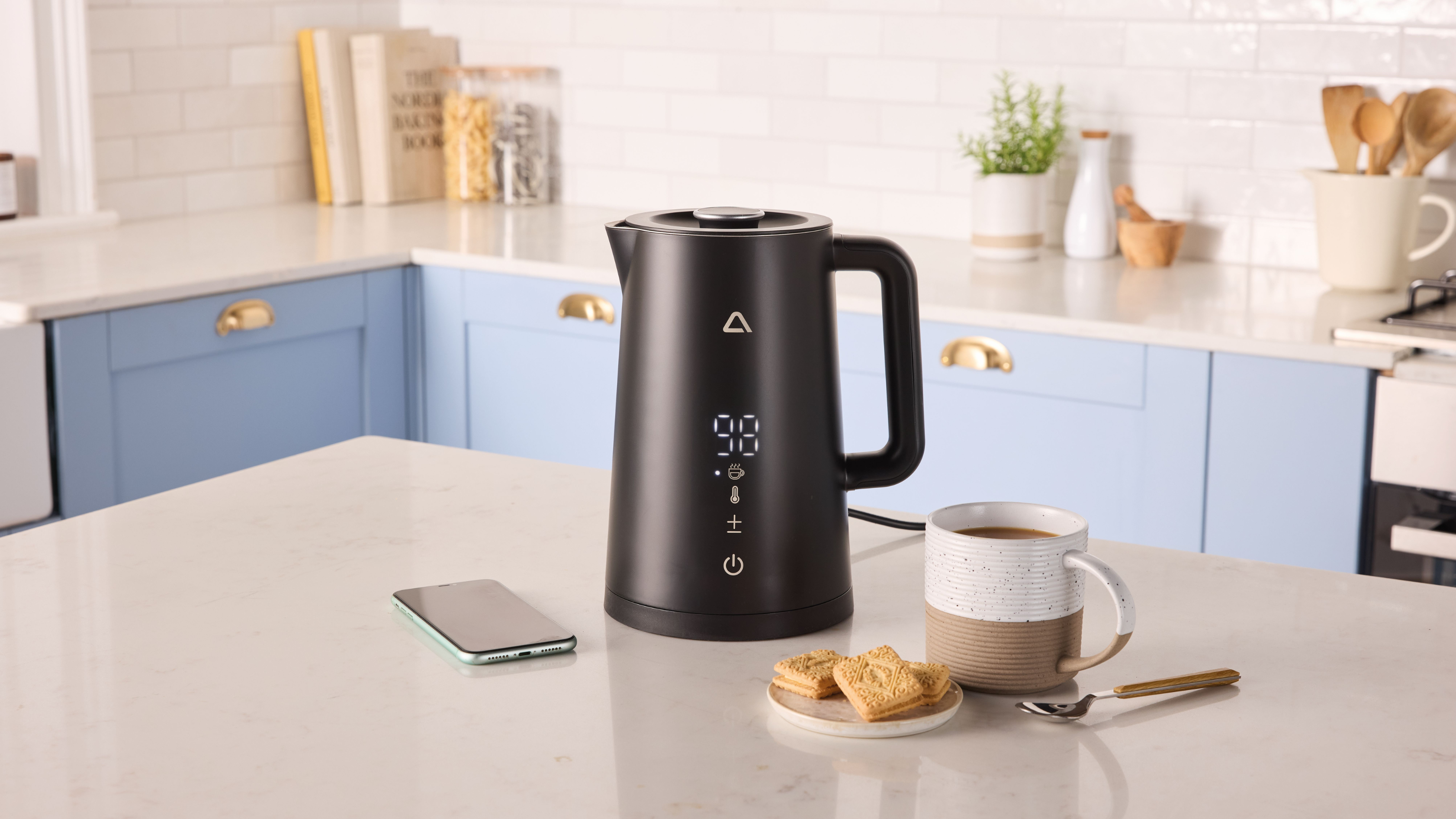 Aldi smart kettle in modern blue kitchen.