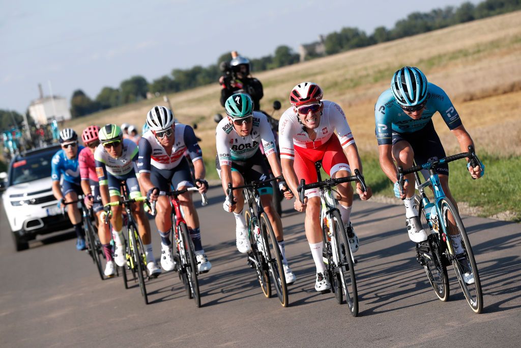 PRZEMYSL POLAND AUGUST 10 LR Lukas Pstlberger of Austria and Team Bora Hansgrohe Patryk Stosz of Poland and Team Poland Reprezentacja Polski Nikita Stalnov of Kazakhstan and Team Astana Premier Tech in the Breakaway during the 78th Tour de Pologne 2021 Stage 2 a 201km stage from Zamo to Przemyl 341m TourdePologne TDP2021 UCIWT on August 10 2021 in Przemysl Poland Photo by Bas CzerwinskiGetty Images