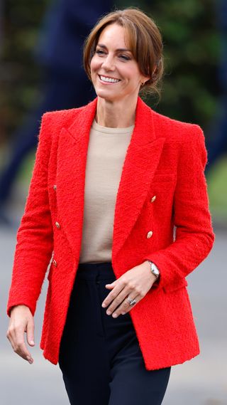 Kate Middleton wears a red blazer as she joins a Portage Session for her 'Shaping Us' campaign on early childhood on September 27, 2023 in Sittingbourne, England. Portage is a service which supports children with disabilities and special educational needs and their families.