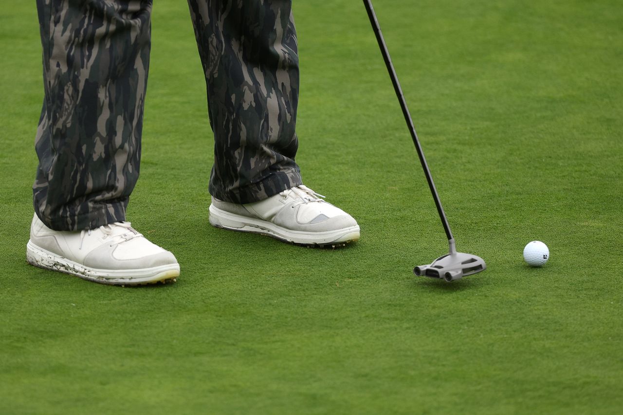 A detail view of the shoes of Jason Day of Australia as he putts on the 14th green during the third round of the AT&amp;T Pebble Beach Pro-Am