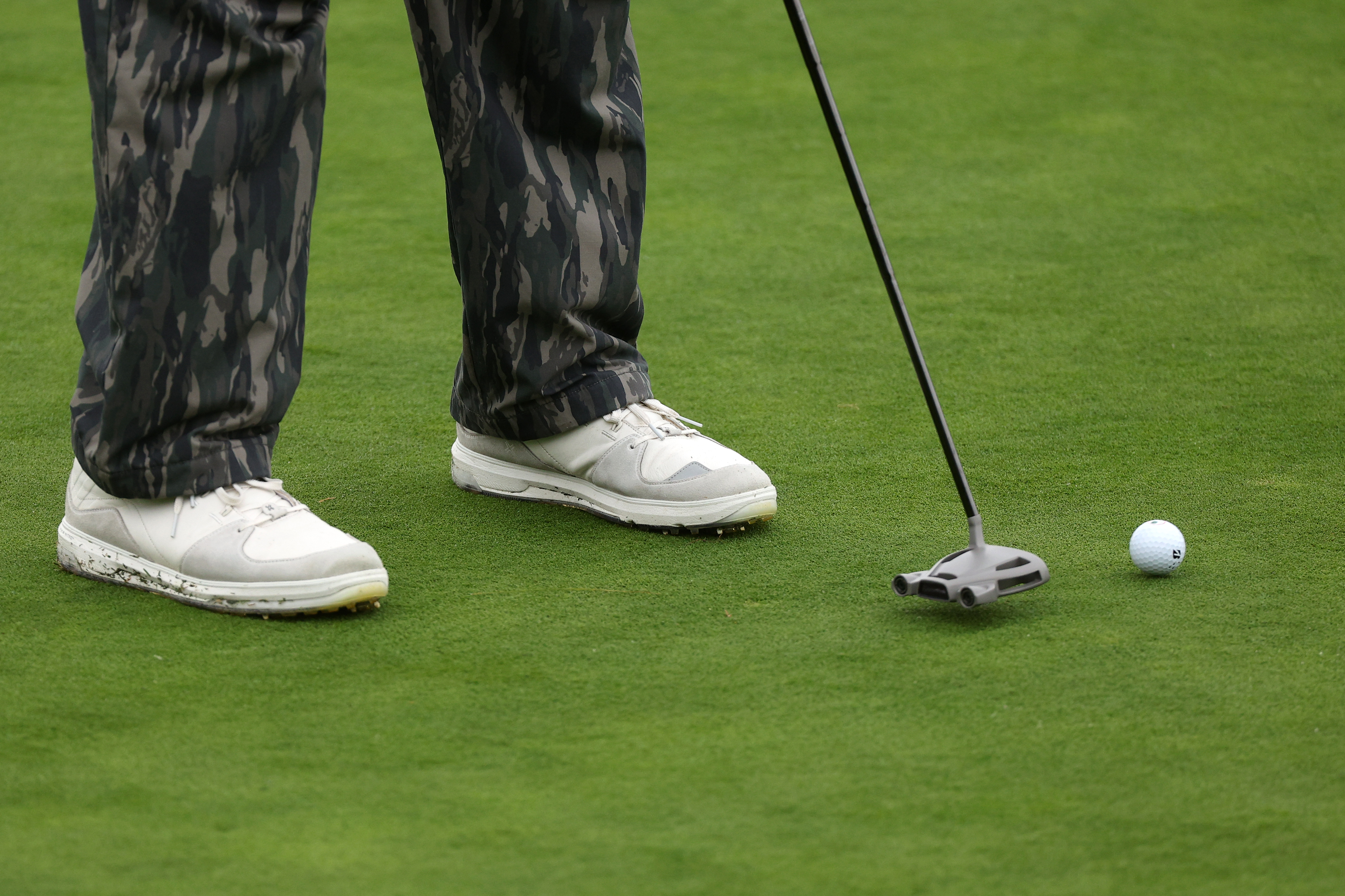 A detail view of the shoes of Jason Day of Australia as he putts on the 14th green during the third round of the AT&T Pebble Beach Pro-Am