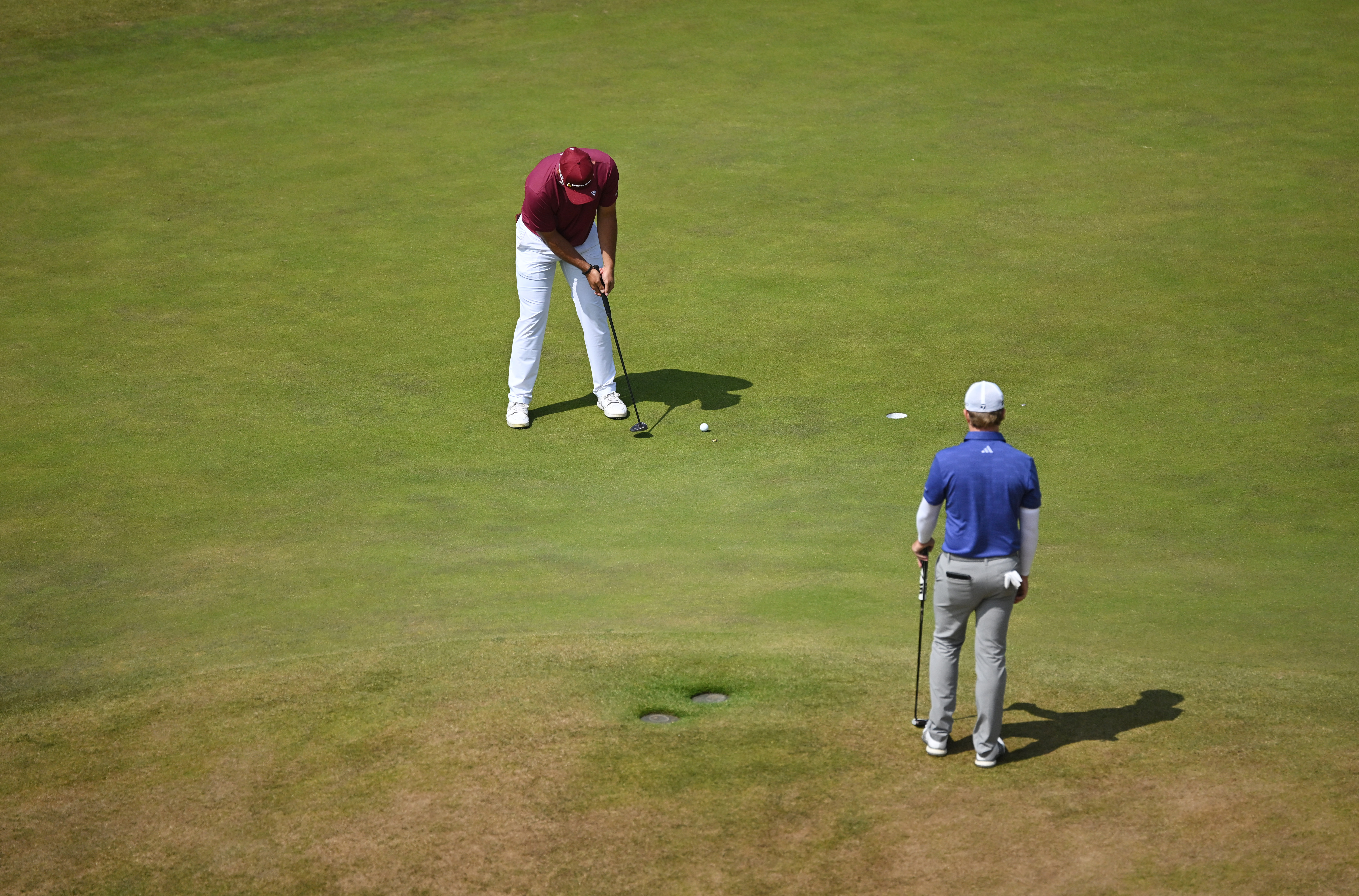 Lucas Herbert hits a putt at The Open
