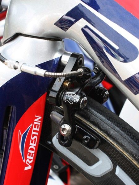 The Tektro front brake is tucked behind the fork crown.