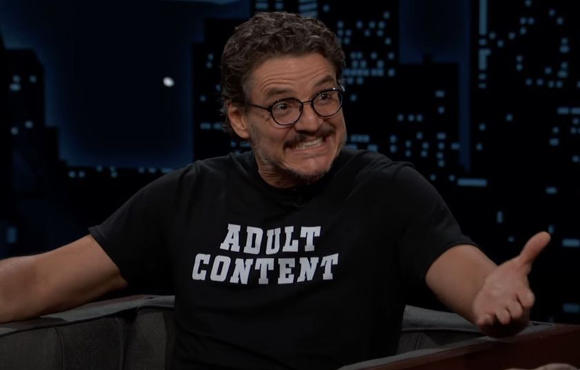 Pedro Pascal smiles broadly while sitting on set for Jimmy Kimmel Live.