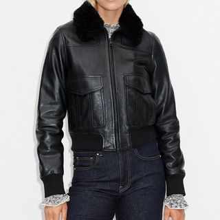 model wearing me+em leather bomber jacket with a black shearling collar