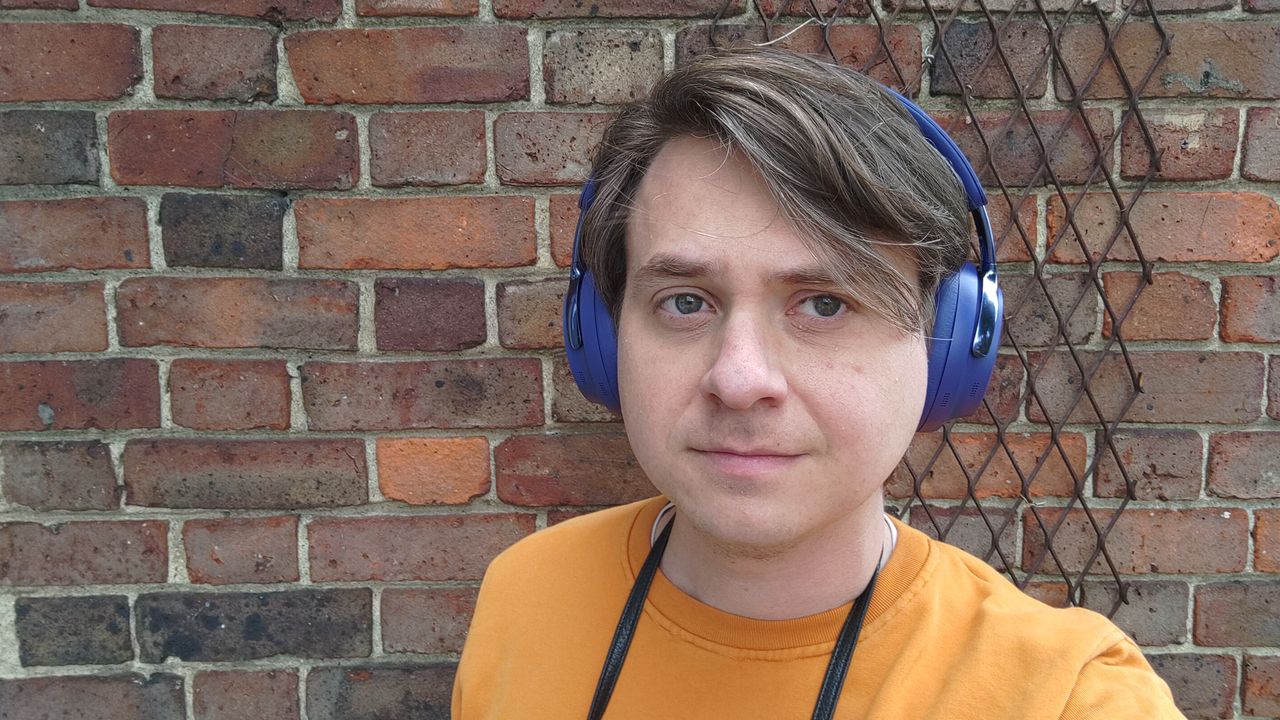 Photograph of man wearing Bose QuietComfort Ultra Gen 2 headphones