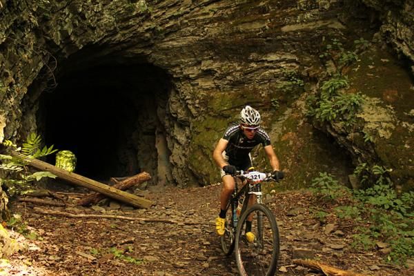 Jeramiah Bishop pilots his Cannondale through an abandoned train tunnel approximately one mile from the finish.