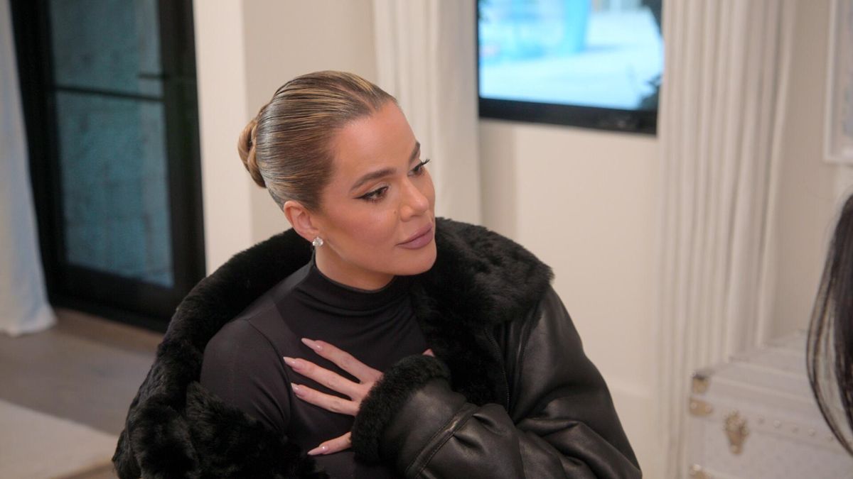 Khloé Kardashian sitting down in all black in The Kardashians season 4