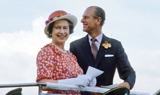 Queen Elizabeth ll and Prince Phillip the Duke of Edinburgh smile during a visit to Fiji