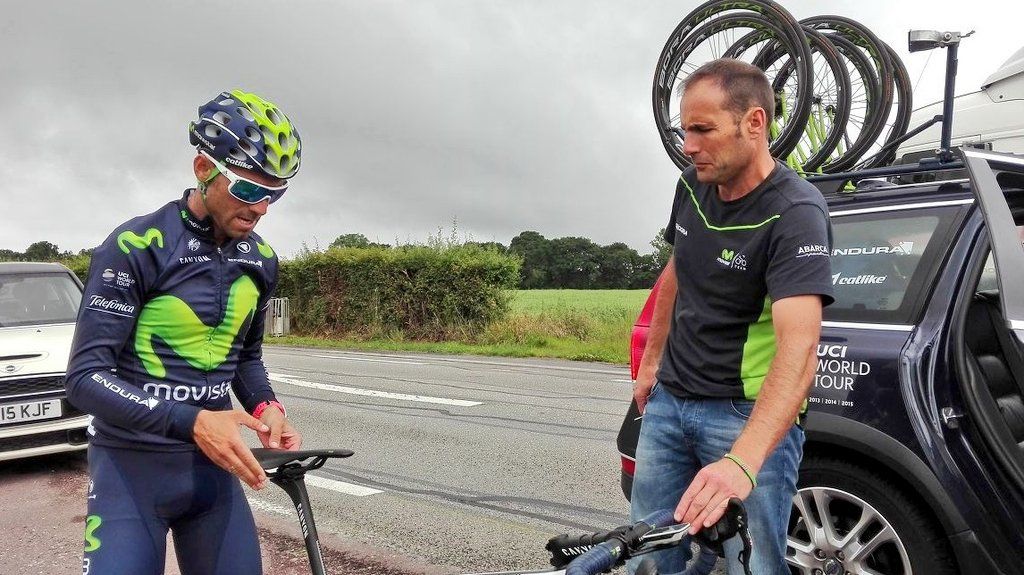 Alejandro Valverde makes some adjustments to his saddle