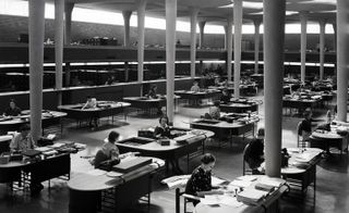 Clerks working in open plan administration building