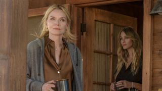 Stacy Clyburn and Abigail Reese standing on front porch holding coffee mugs in The Madison Season 1