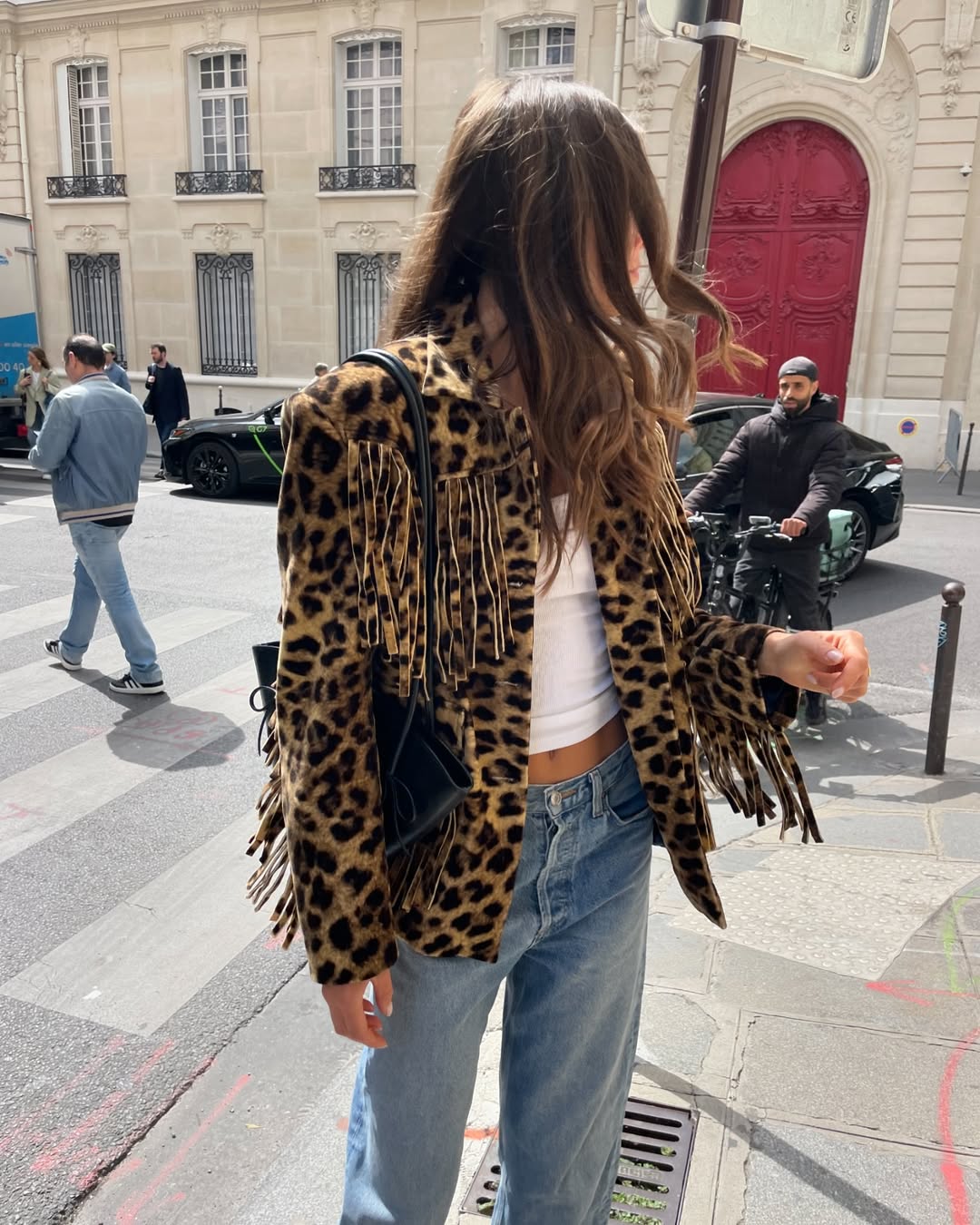 influencer @lunaisabellaa wearing a leopard fringe jacket in Paris