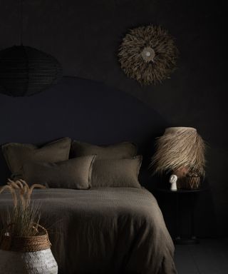 Abigail Ahern’s surprising colors that will make a room look bigger, dark bedroom with brown paint and fabric