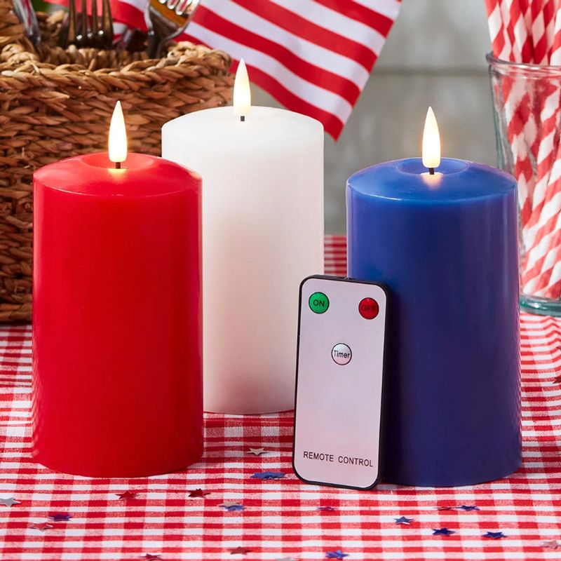 red white and blue flameless candles on a red and white gingham tablecloth ideal as coronation decorations