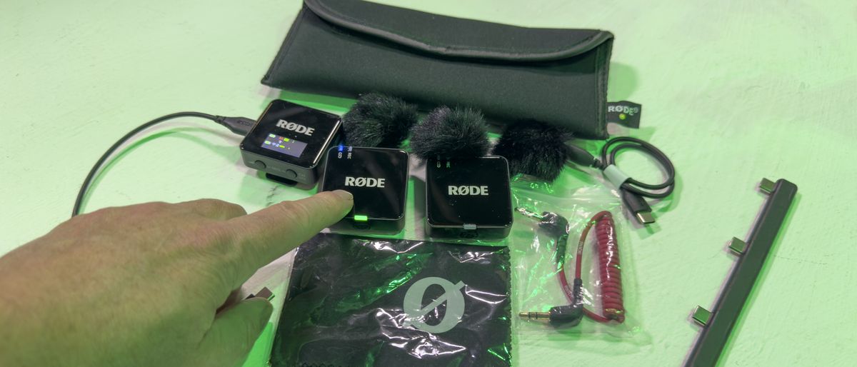 RØDE Wireless Go Gen 3 kit with a finger pointing to the a transmitter