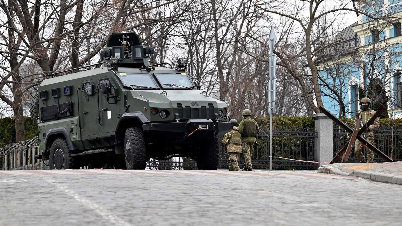 Ukrainian Military Forces servicemen block a road in Kyiv