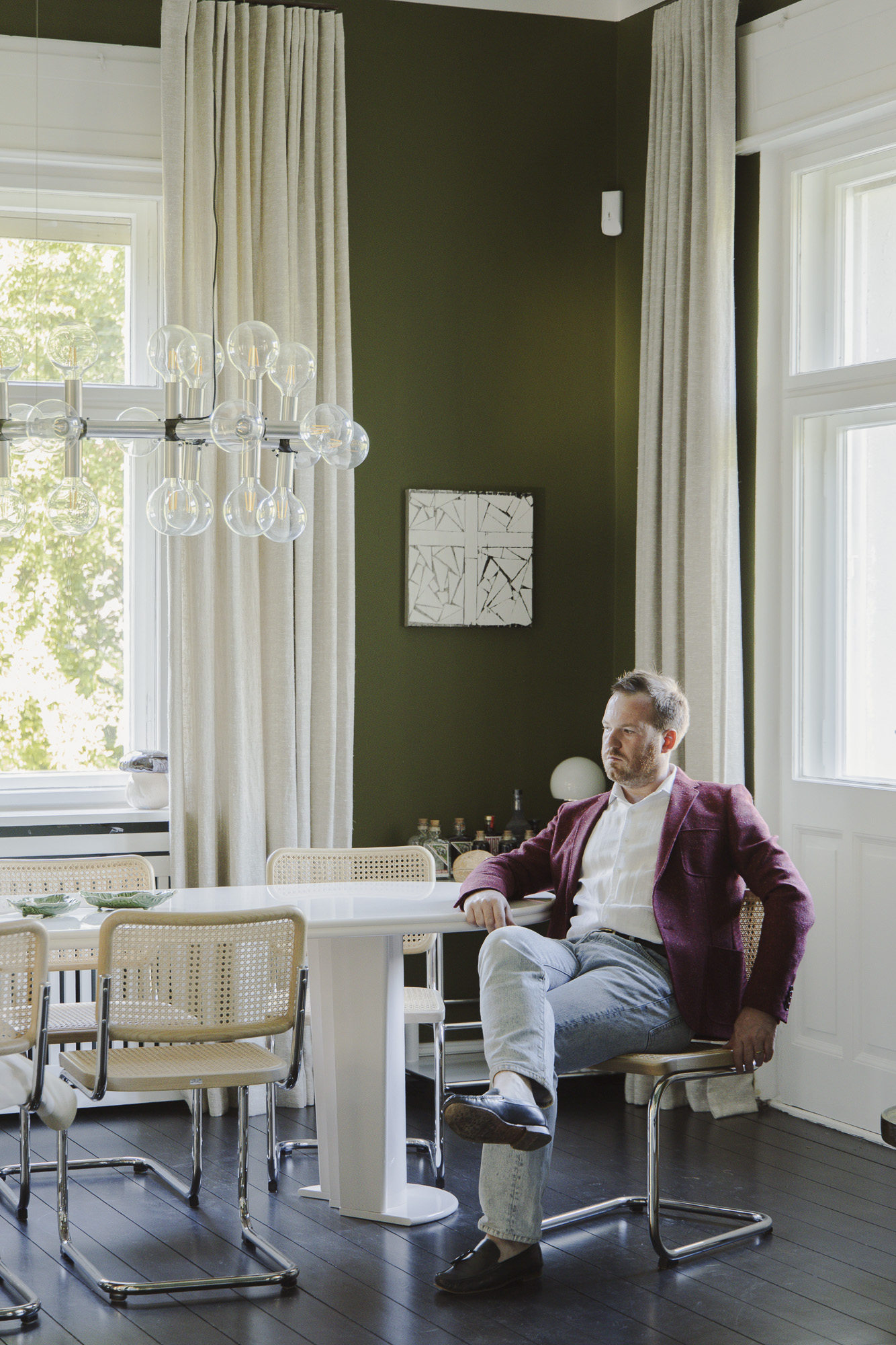 Balancedly designed interiors with plenty of natural light, pastel palettes, sculptural pieces, and curated artwork, with floor-to-ceiling walls and arched walls.