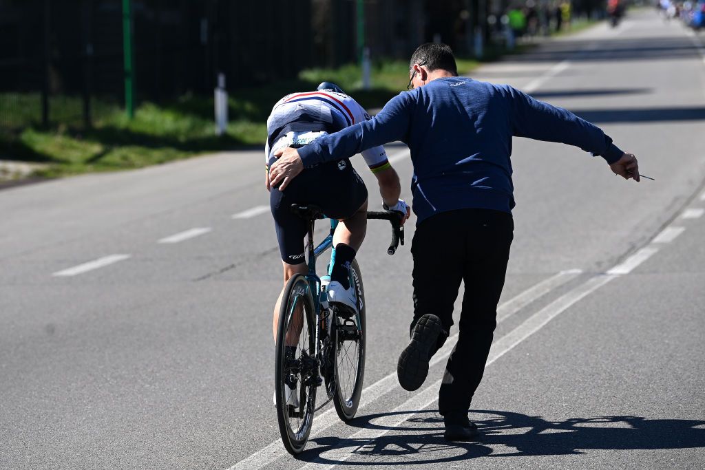 ORBASSANO ITALY MARCH 15 Mark Cavendish of The United Kingdom and Astana Qazaqstan Team assisted by a mechanic due to a mechanical problem during the 104th MilanoTorino 2023 a 192km one day race from Rho to Orbassano MilanoTorino on March 15 2023 in Orbassano Italy Photo by Tim de WaeleGetty Images